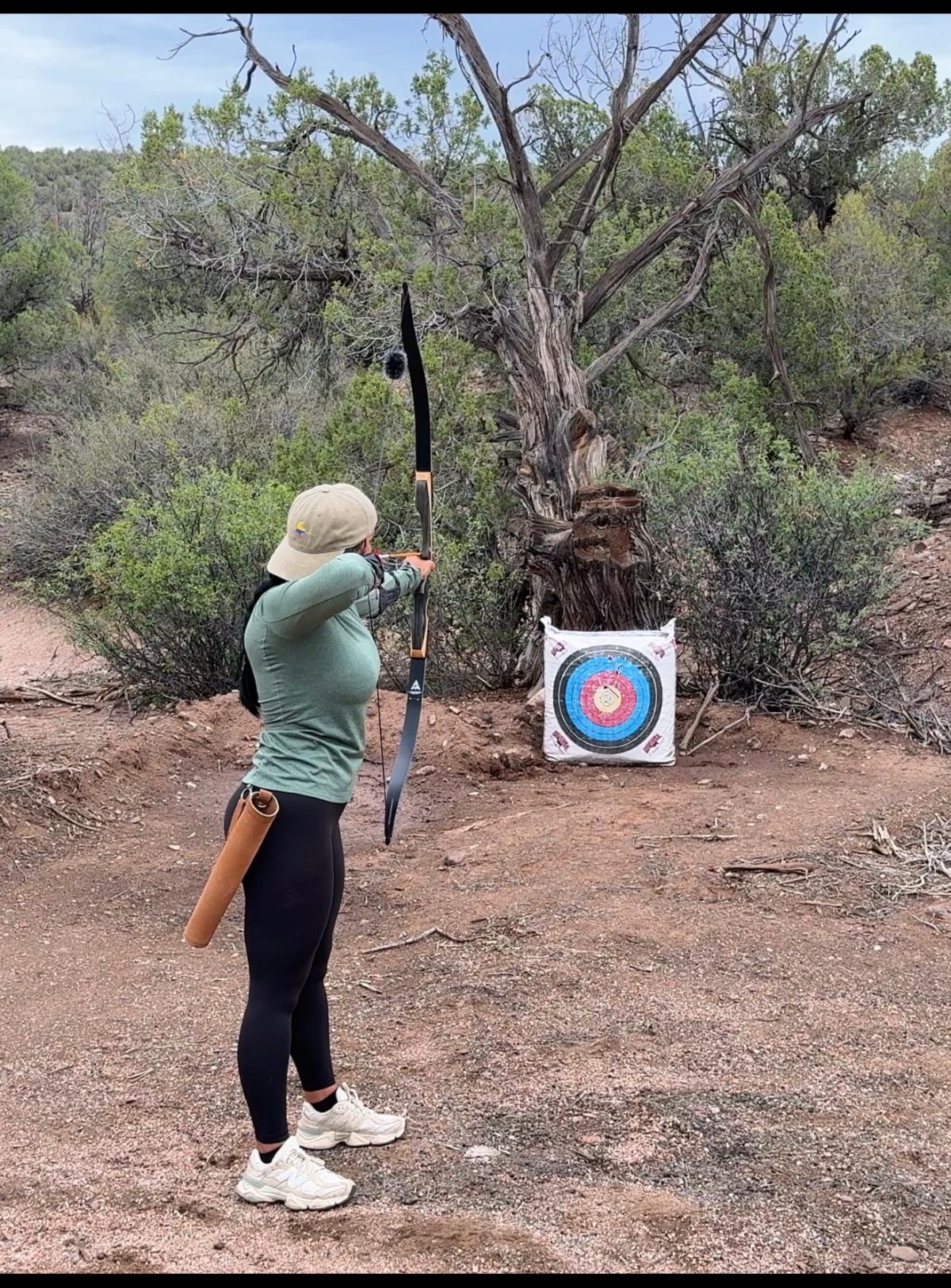 Paola shooting recurve at a target